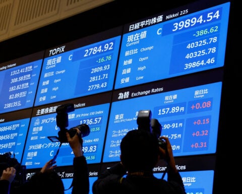 Asia shares wary, dollar upbeat before data deluge