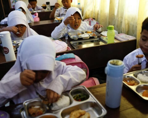 Indonesia dishes out first free meals in programme targeting 83 million people