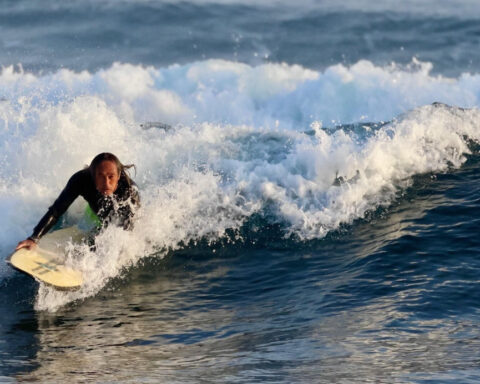 'So happy': Shark attack victim surfing again after recovery