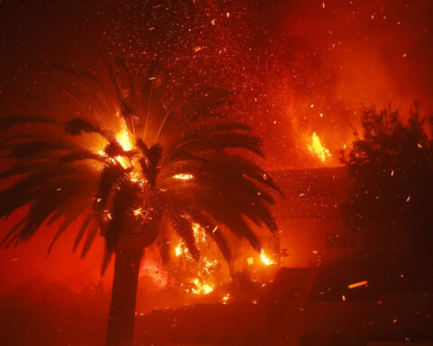 California governor says Pacific Palisades wildfire has destroyed many structures as winds kick up