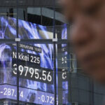 Stock market today: Asian shares slip after Wall St slumps despite strong US economic data