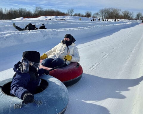 Scarves over headscarves, Muslim women’s outdoors group tackles snow tubing in Minnesota