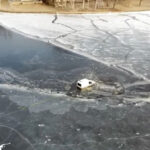 Van delivering food to ice fisherman goes through ice in Lake