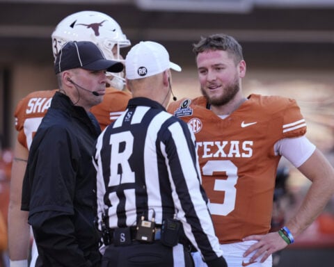 Texas and Ohio State arrive for CFP semifinal at Cotton Bowl ahead of a winter storm