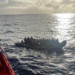 A photo captures rescue of a baby born on dangerous sea crossing to Spain's Canary Islands