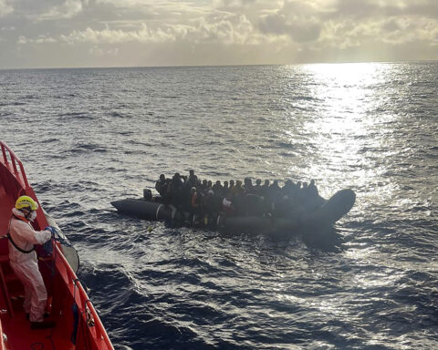 A photo captures rescue of a baby born on dangerous sea crossing to Spain's Canary Islands