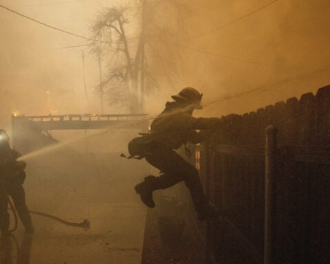 Wildfires latest: Tens of thousands ordered to evacuate as fires tear through Los Angeles area