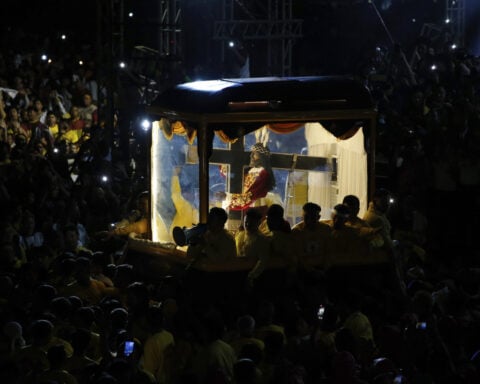 Filipino Catholics pray for good health and peace in huge procession venerating Jesus statue