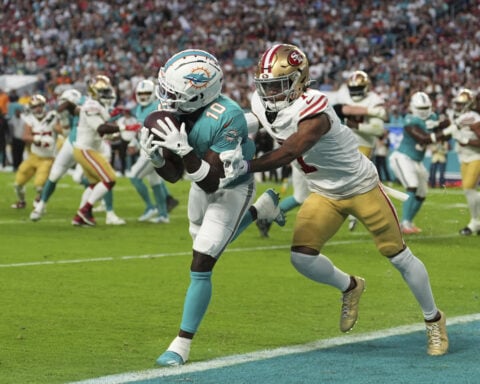 Tyreek Hill's agent says he's committed to the Dolphins and he played in 2024 with a broken wrist