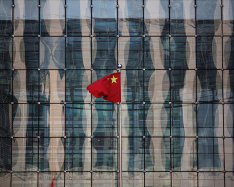 China's central bank halts bond buying as yuan struggles