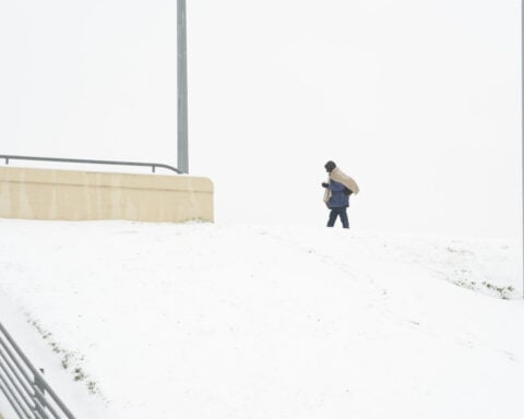 Winter storm plods into the Deep South, prompting states of emergency and school closures