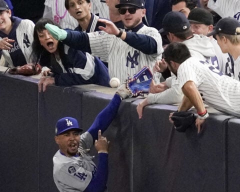 Yankees fans who interfered with Mookie Betts during World Series banned from all MLB games