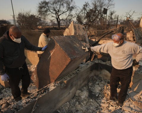 With their Los Angeles-area homes still smoldering, families return to search the ruins for memories