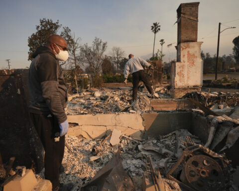 Families in shock begin to visit their charred homes in the Los Angeles area