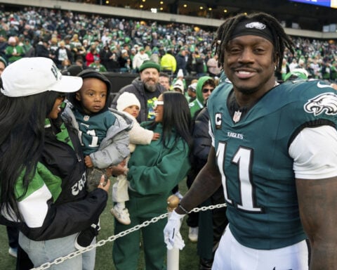 Turning the page: Eagles receiver A.J. Brown reads inspirational book on sideline during playoff win