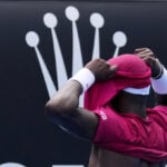 Frances Tiafoe picks up a tough victory after throwing up at the Australian Open