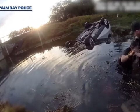 Bodycam video shows officers rescuing pregnant woman from overturned car that went into canal