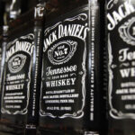 Jack Daniels' parent Brown-Forman is cutting its workforce and closing its barrel-making plant