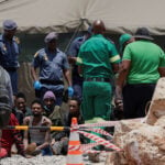 Body count from South African mine siege rises to 60