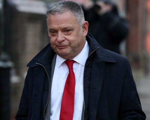 British lawmaker Amesbury pleads guilty to assault after punching passerby