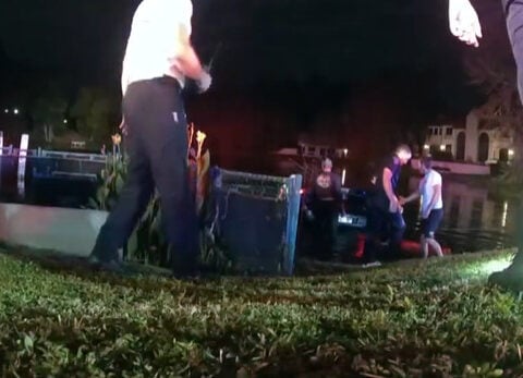 Police: 80-year-old man rescued from sinking truck in pond