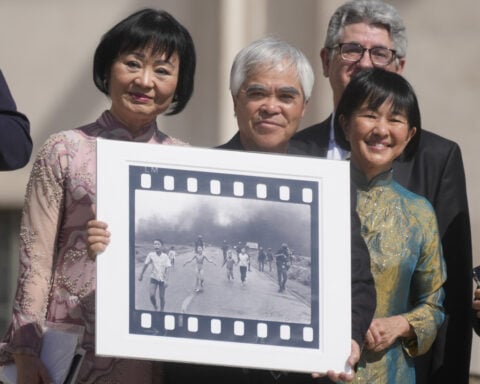 He is credited with one of history's most indelible photos. A new documentary questions who took it