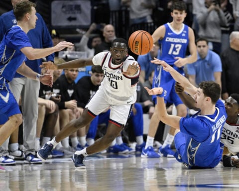 Neal scores career-high 24 and Creighton snaps No. 14 UConn's 28-game home winning streak, 68-63