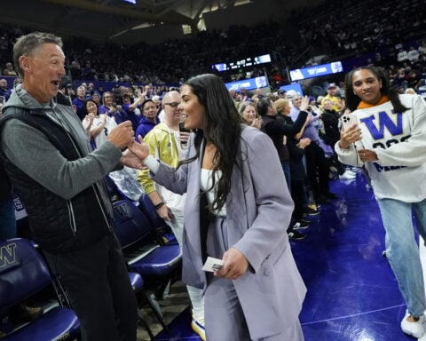 Washington retires its first women's jersey, sending Kelsey Plum's No. 10 to the rafters