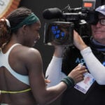 Coco Gauff writes 'RIP TikTok USA' on a TV camera at the Australian Open