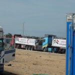 Aid trucks arrive at Israeli-controlled Kerem Shalom crossing ahead of Gaza entry, two sources say