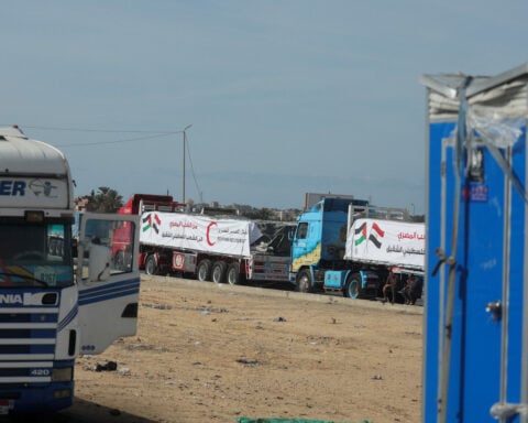 Aid trucks arrive at Israeli-controlled Kerem Shalom crossing ahead of Gaza entry, two sources say