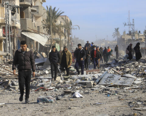 Palestinians trek across rubble to return to their homes as Gaza ceasefire takes hold