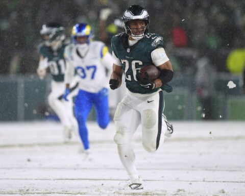 Barkley runs for 78- and 62-yard TDs in the snow and Eagles top Rams 28-22 to head to NFC title game