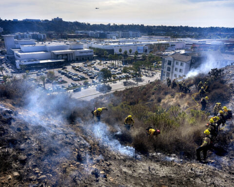 As fire-fanning winds continue, Southern California readies for potential rain and toxic runoff