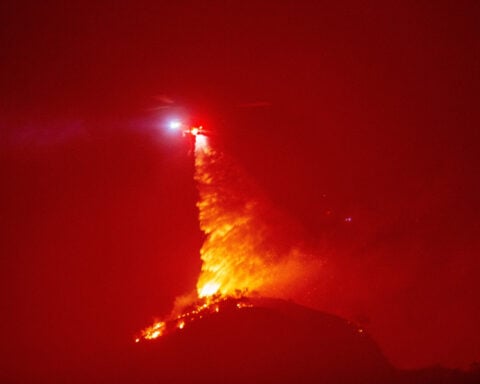 Massive new Los Angeles-area fire balloons as winds pick up