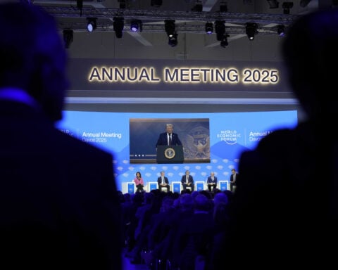 Trump tells Davos elite to invest in US or face tariffs