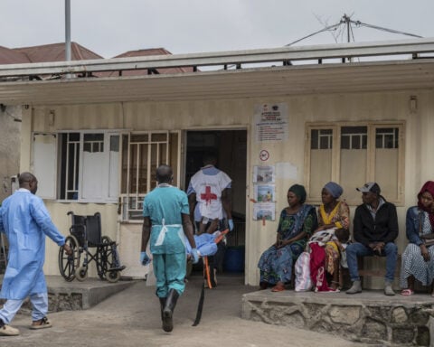 Panic spreads in eastern Congo's largest city as rebels battling the army close in on Goma