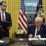 Who's the guy handing Trump those binders of executive orders? Meet Will Scharf