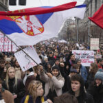 Driver rams an anti-government rally in Serbia's capital and injures one protester