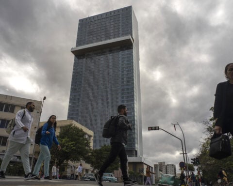 A new luxury hotel towers over Havana as Cuba's economic troubles mount and tourism plummets