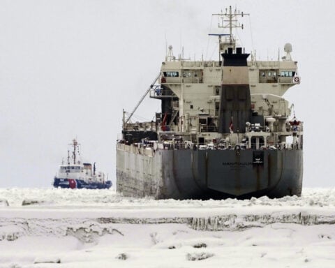 Freighter remains stuck in the ice on a frozen Lake Erie