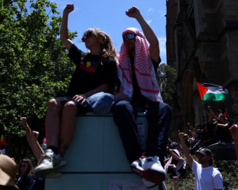 Monuments defaced as Australians protest, celebrate national day