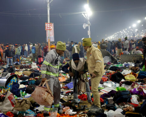 Bodies, clothes, bags lie on ground after stampede at mass Hindu gathering in India