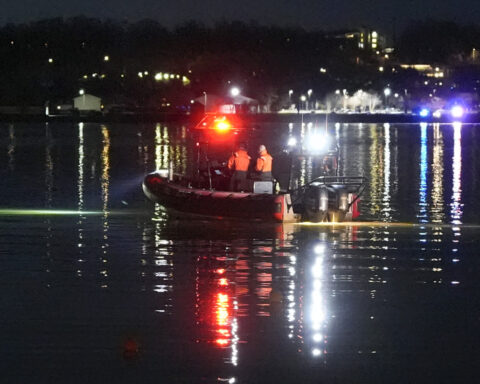 Passenger jet with 64 aboard collides with Army helicopter while landing at Reagan Airport near DC