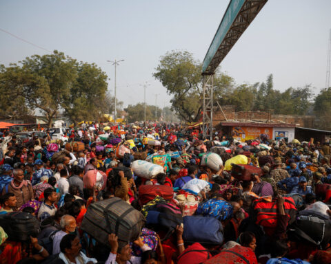 Millions of Hindus take 'holy dip' a day after fatal stampede