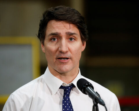 Trudeau says Canada would respond to tariffs, warns of tough times to come