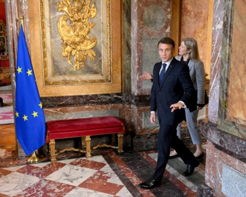 Europe will have to make itself respected if commercial interests attacked, Macron says