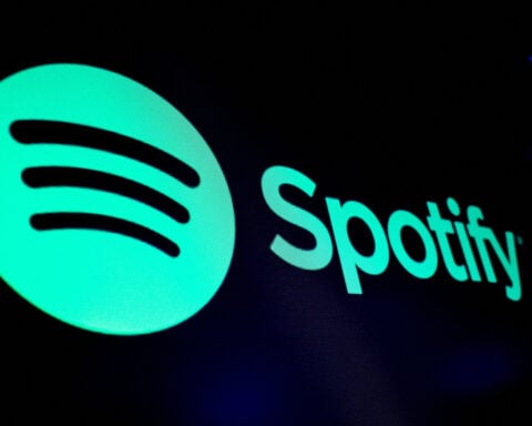 Spotify predicts strong quarter after cost cuts power first annual profit