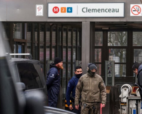 Belgian police hunting two suspects after Brussels metro shooting