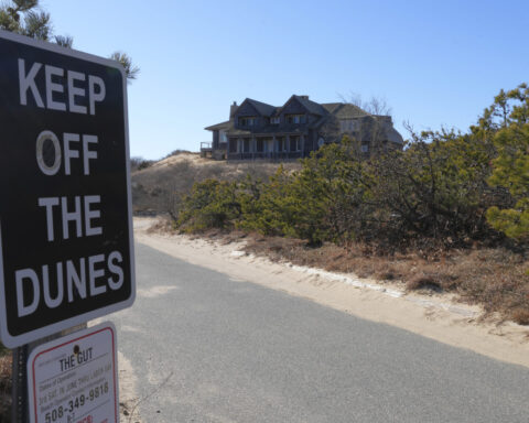 Wind and water are slowly taking this luxury house overlooking Cape Cod Bay